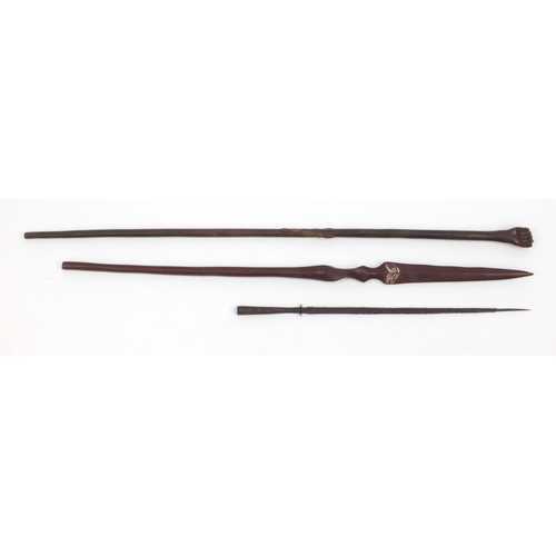 645 - Tribal interest wooden staff carved with a clenched fist pommel, woodens pear and a metal spear head... 