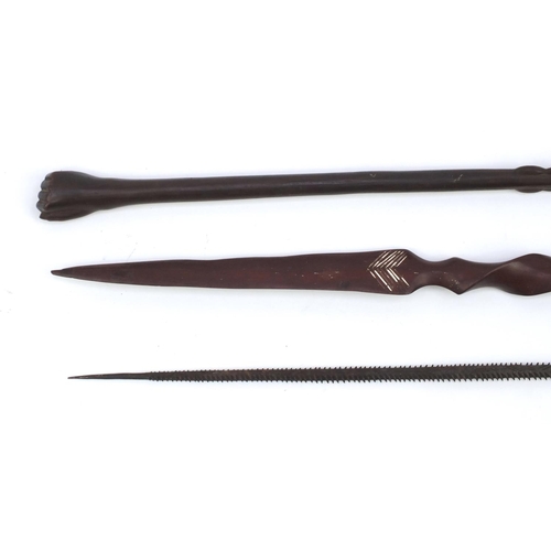 645 - Tribal interest wooden staff carved with a clenched fist pommel, woodens pear and a metal spear head... 