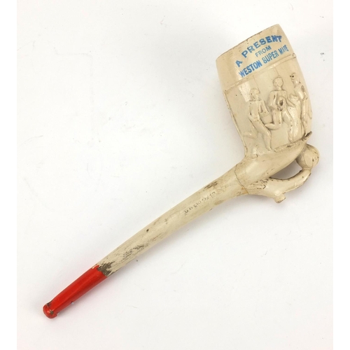 86 - Present from Weston-super-Mare clay pipe decorated with footballers, registration number 241693, imp... 