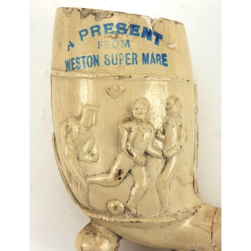 86 - Present from Weston-super-Mare clay pipe decorated with footballers, registration number 241693, imp... 