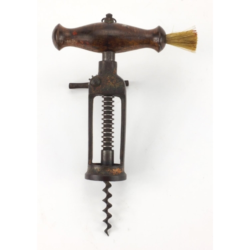 79 - 19th century steel corkscrew with wooden handle and side brush, 18cm in length