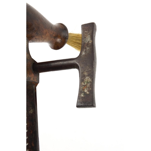 79 - 19th century steel corkscrew with wooden handle and side brush, 18cm in length