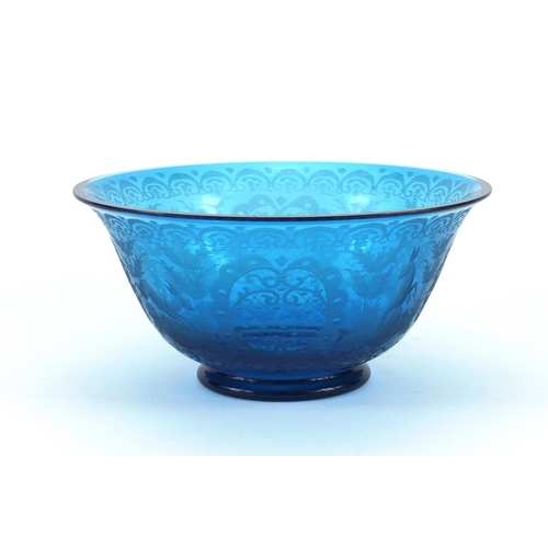 704 - 19th century Bavarian blue glass bowl etched with hares amongst flowers and foliage, 23cm in diamete... 