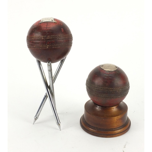 139 - Two cricket ball awards one with stump stand, one raised on a wooden base, both with engraved silver... 