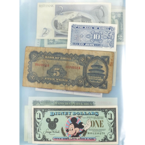 221 - British, Chinese and World banknotes housed in an album including one pound notes, one pound ten shi... 