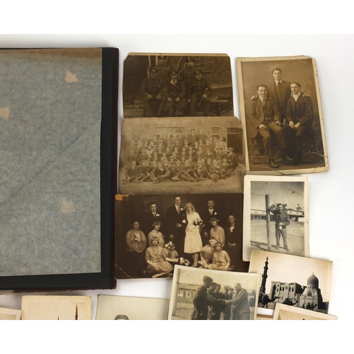 321 - Predominantly World War II black and white photographs including Military, some housed in two albums... 