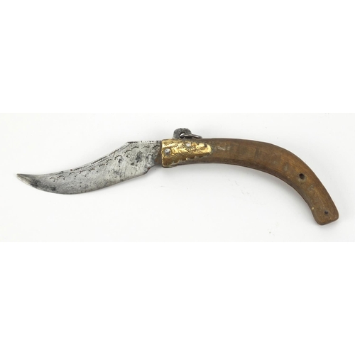 69 - Antique folding knife with engraved steel blade, 14cm wide when closed