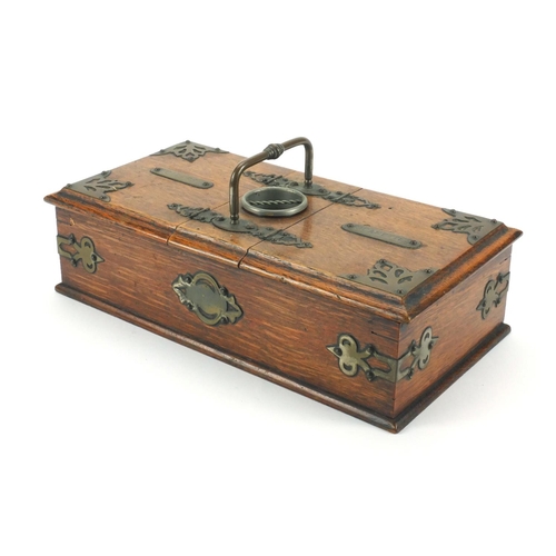 45 - Edwardian oak smokers travelling box with brass mounts, carrying handle and two compartments, 13cm h... 