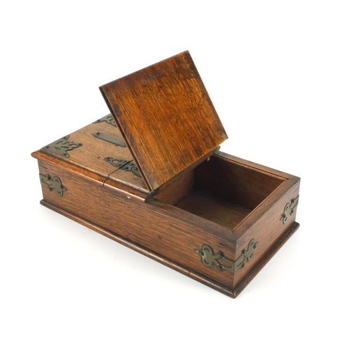 45 - Edwardian oak smokers travelling box with brass mounts, carrying handle and two compartments, 13cm h... 