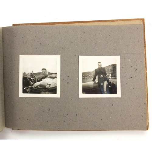 320 - Military interest black and white photographs housed in an album, including Ruins of planes, village... 