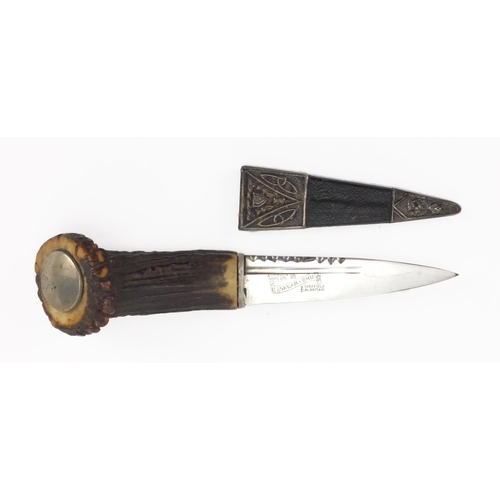 70 - Scottish Skean-Dhu with bone handle and siver mounted leather sheath with silver mounts, 19.5cm in l... 