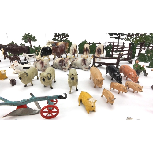 389 - Hand painted lead farmyard animals and accessories including some Britain's examples