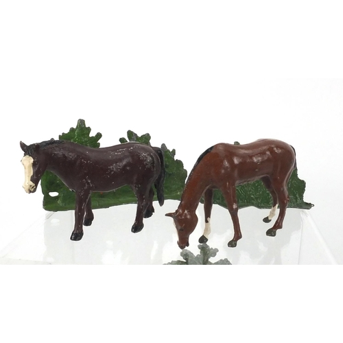 389 - Hand painted lead farmyard animals and accessories including some Britain's examples