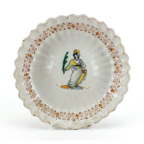 673 - Continental Majolica footed dish, hand painted with a figure and floral boarder, 23cm in diameter