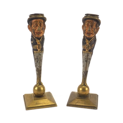 63 - Pair of 19th century brass caricature candlesticks, both inscribed Hausse, the largest 17cm high