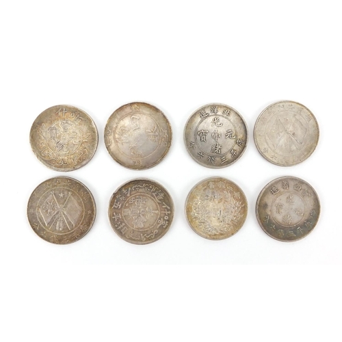 217 - Eight Chinese silver coins, each 3.4cm in diameter, approximate weight 112.9g