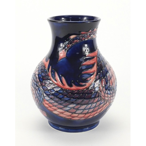 2163 - Moorcroft pottery baluster vase, hand painted and tube lined with a snarling scaly dragon onto a blu... 