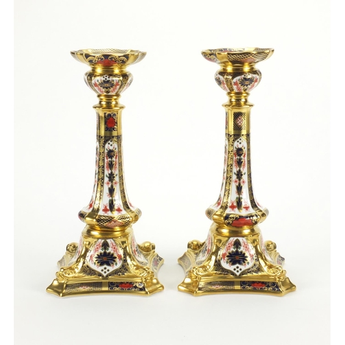 2121 - Large pair of Royal Crown Derby old Imari pattern candlesticks with dolphin and gold block design, b... 