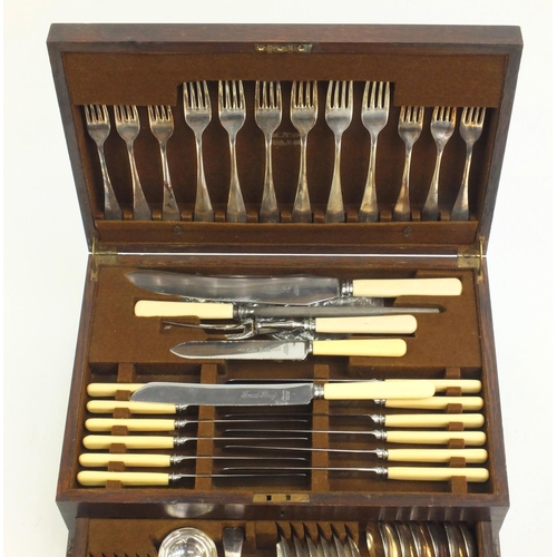 2153 - Six place canteen of silver plated cutlery some with ivorine handles, housed in an oak canteen with ... 