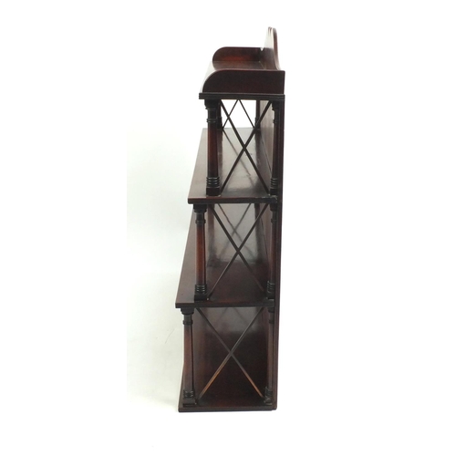 2049 - Mahogany three tier wall hanging  bookcase with turned  supports, 77cm high x 79cm wide x 16cm deep