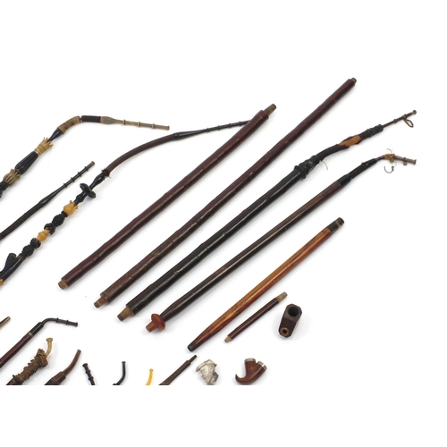 88 - Collection of pipe stems including burr, Mother of Pearl inlaid and black forest examples, the large... 