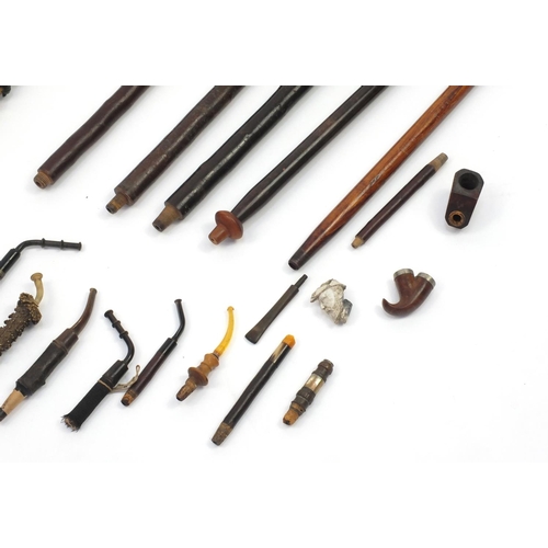 88 - Collection of pipe stems including burr, Mother of Pearl inlaid and black forest examples, the large... 