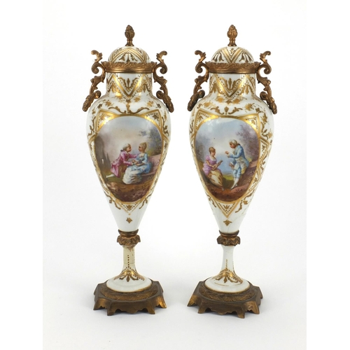 651 - Pair of 19th century Sevres urns and covers, hand painted and gilded with flowers and figures, initi... 