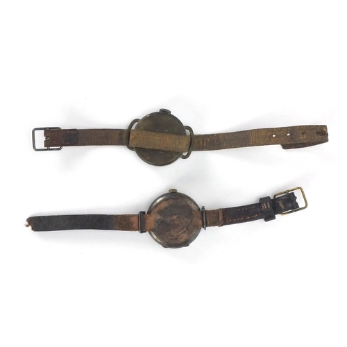 310 - Two Military interest trench watches including a silver example with luminous hands, both with leath... 