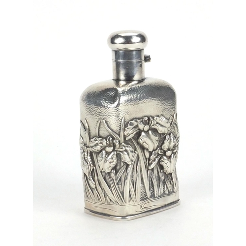 552 - Japanese silver flask, embossed with flowers, character marks to the base, 12cm high, approximate we... 