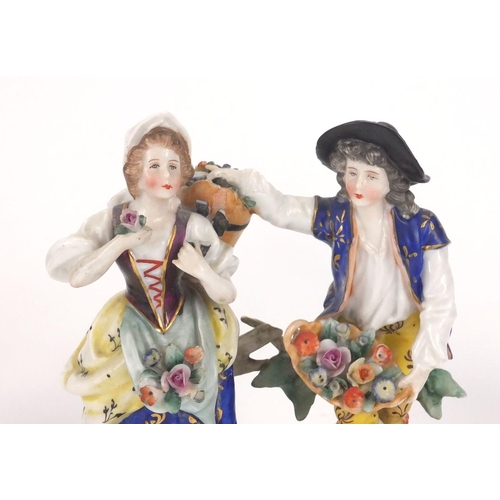 661 - Five continental hand painted porcelain figures including two pairs and a group of a young male and ... 