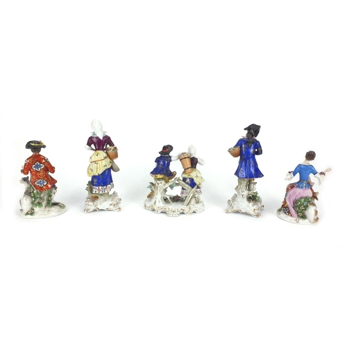 661 - Five continental hand painted porcelain figures including two pairs and a group of a young male and ... 