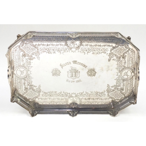 895 - Silver plated twin handled gallery tray profusely engraved with a floral boarder and panels of birds... 