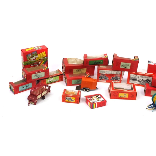 446 - Eighteen Britain's agricultural accessories, all boxed, including Class trailer 9566, Loader wagon 9... 