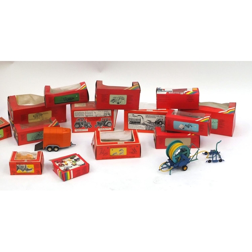 446 - Eighteen Britain's agricultural accessories, all boxed, including Class trailer 9566, Loader wagon 9... 