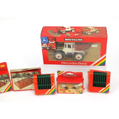 447 - Britain's farmyard shelters and accessories together with two construction vehicles, all boxed, incl... 