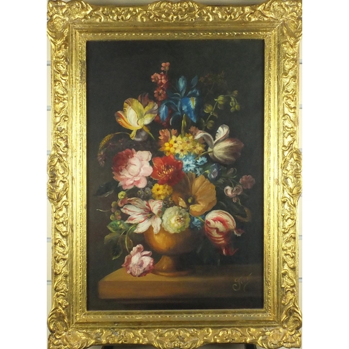 2118 - Oil onto canvas, still life flowers in a vase, bearing a signature Fem? label verso, ornately gilt f... 