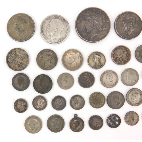 2586 - British and World coinage some silver including half crown, dollars and half dollars, approximate we... 