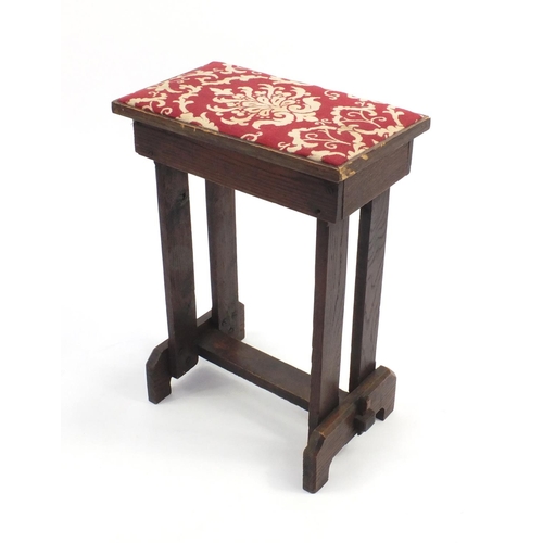 2088 - Arts & Crafts oak stool with red upholstered seat, 53cm high x 38cm wide x 23cm deep