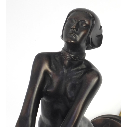 2155 - Bronzed desk lamp modelled with a nude Art Deco lady holding a white opaque globular shade, 71cm hig... 