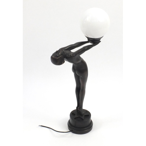 2154 - Bronzed desk lamp modelled with a nude Art Deco lady holding a white opaque globular shade, 71cm hig... 