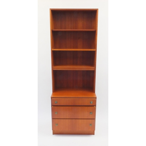 2029 - A.H. Mcintosh & Co teak bookcase fitted with three graduated drawers to the base, label to the insid... 