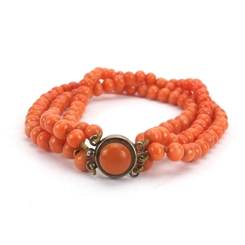 926 - Three row coral necklace and matching bracelet, the necklace 44cm long, approximate weight 59.5g