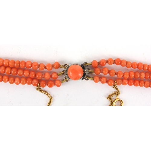 926 - Three row coral necklace and matching bracelet, the necklace 44cm long, approximate weight 59.5g