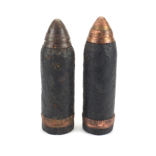 278 - Pair of British Military interest powder shells with heads