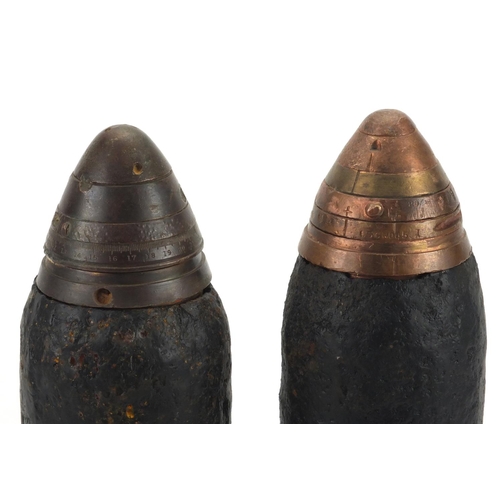 278 - Pair of British Military interest powder shells with heads