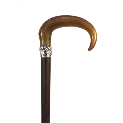 31 - Harwood walking stick with rhino horn handle and silver collar, with floral decoration and engraved ... 