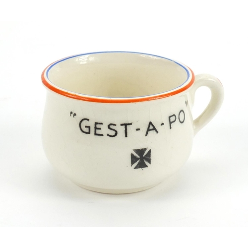 333 - Fielding's crested china Gest-A-Po Hitler chamber pot together with an Adolf Hitler picture book, th... 