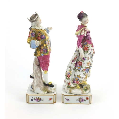 658 - Pair of 19th century continental porcelain figures of lovers, both hand painted with flowers, with c... 