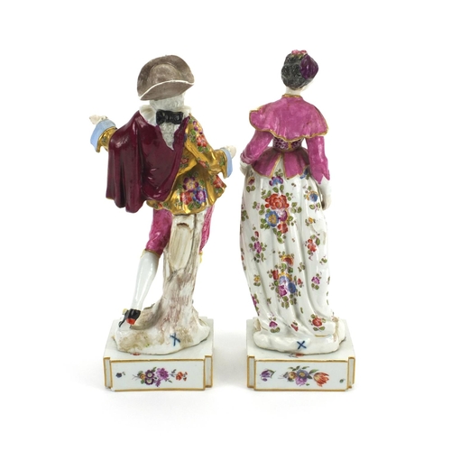 658 - Pair of 19th century continental porcelain figures of lovers, both hand painted with flowers, with c... 