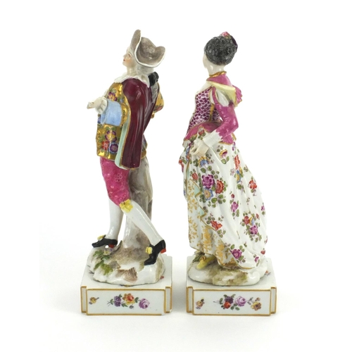 658 - Pair of 19th century continental porcelain figures of lovers, both hand painted with flowers, with c... 